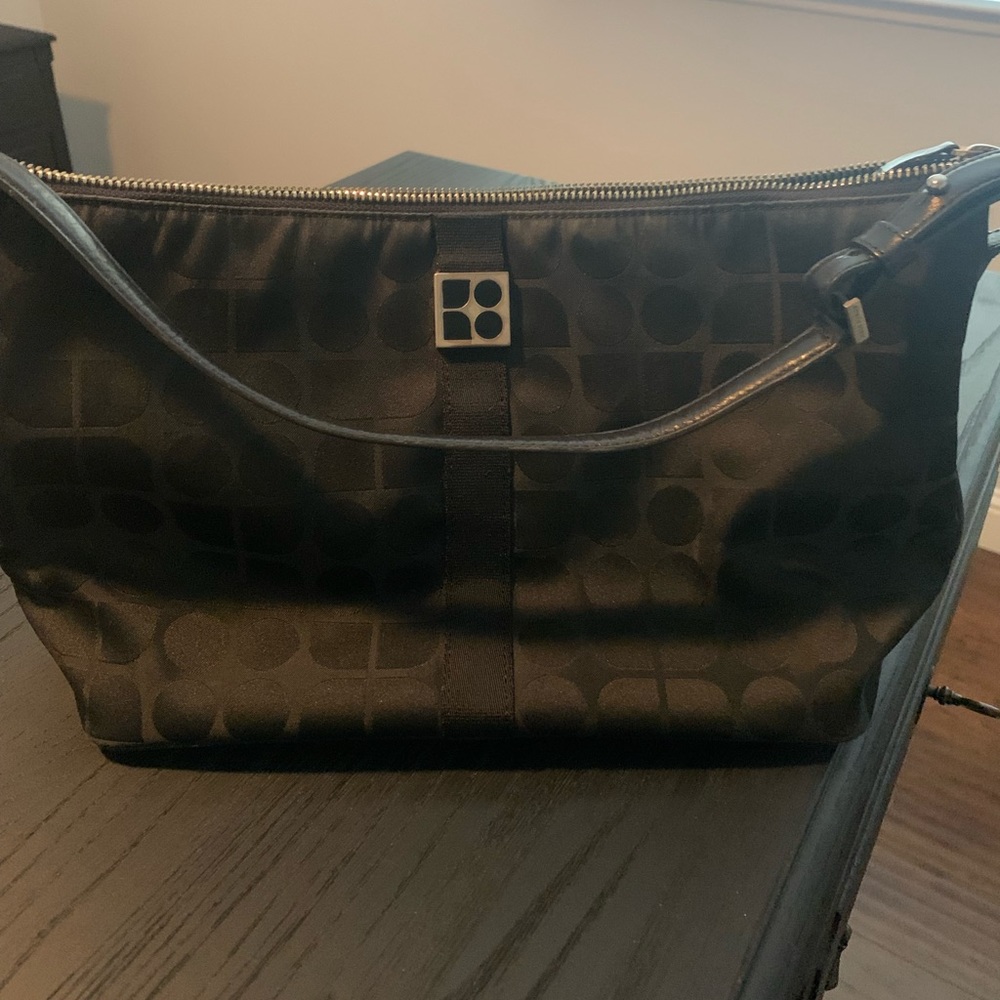 Small black Kate Spade women hand bag.